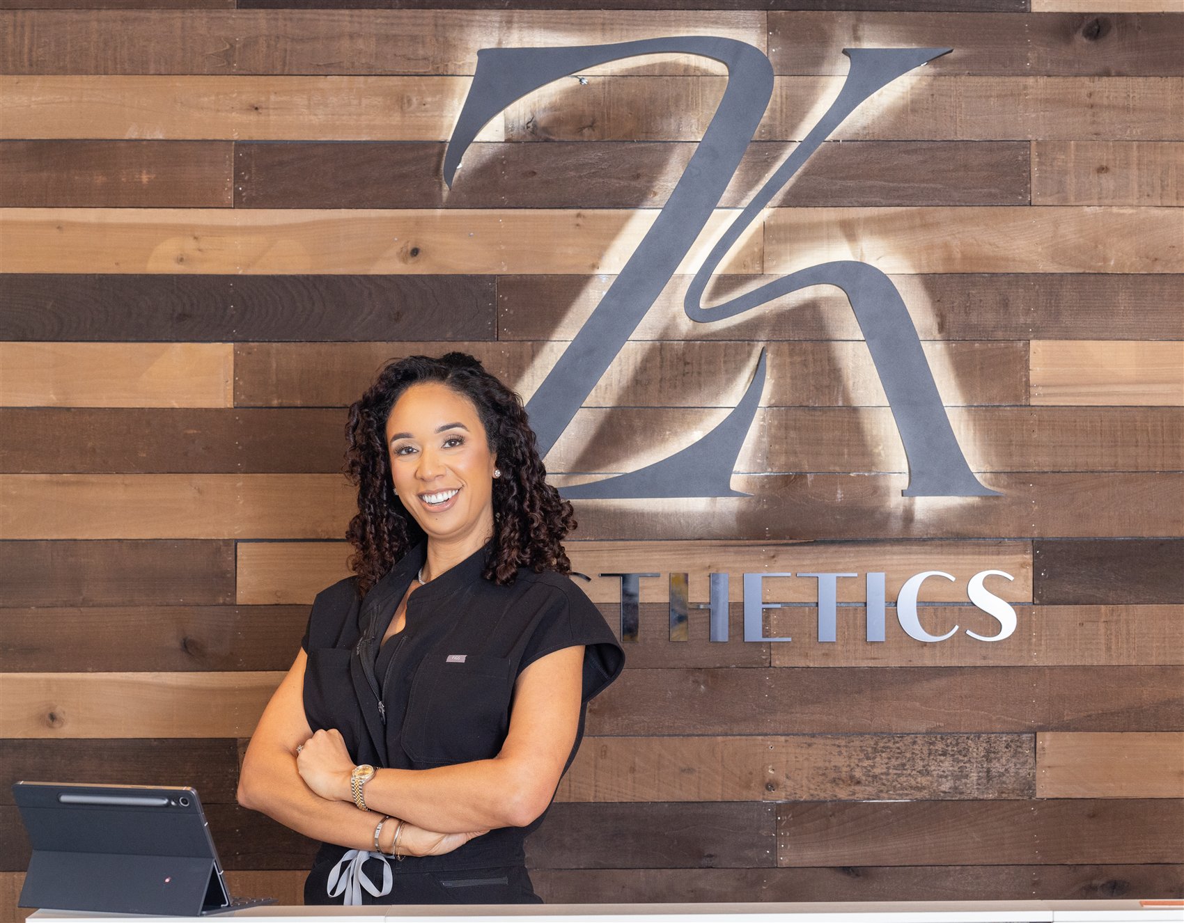 Cassie Lewis, NP at the ZK Aesthetics front desk in Midtown Sacramento